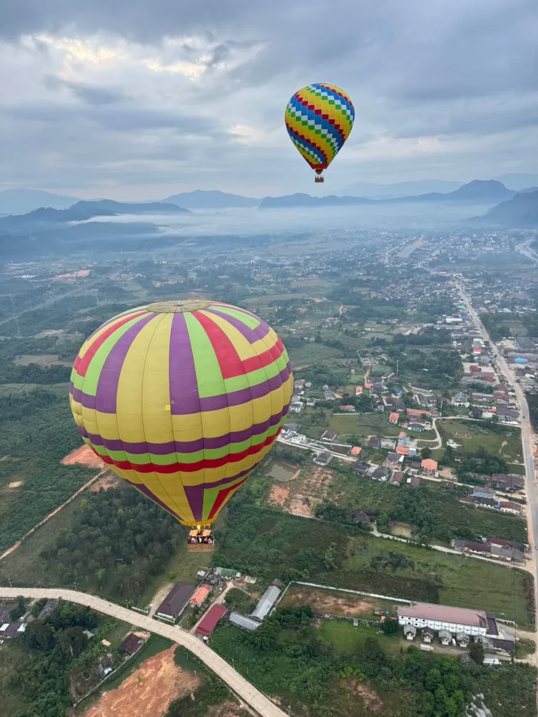hot air balloon over the city of Vang Vieng hot air balloon over the city of Vang Vieng