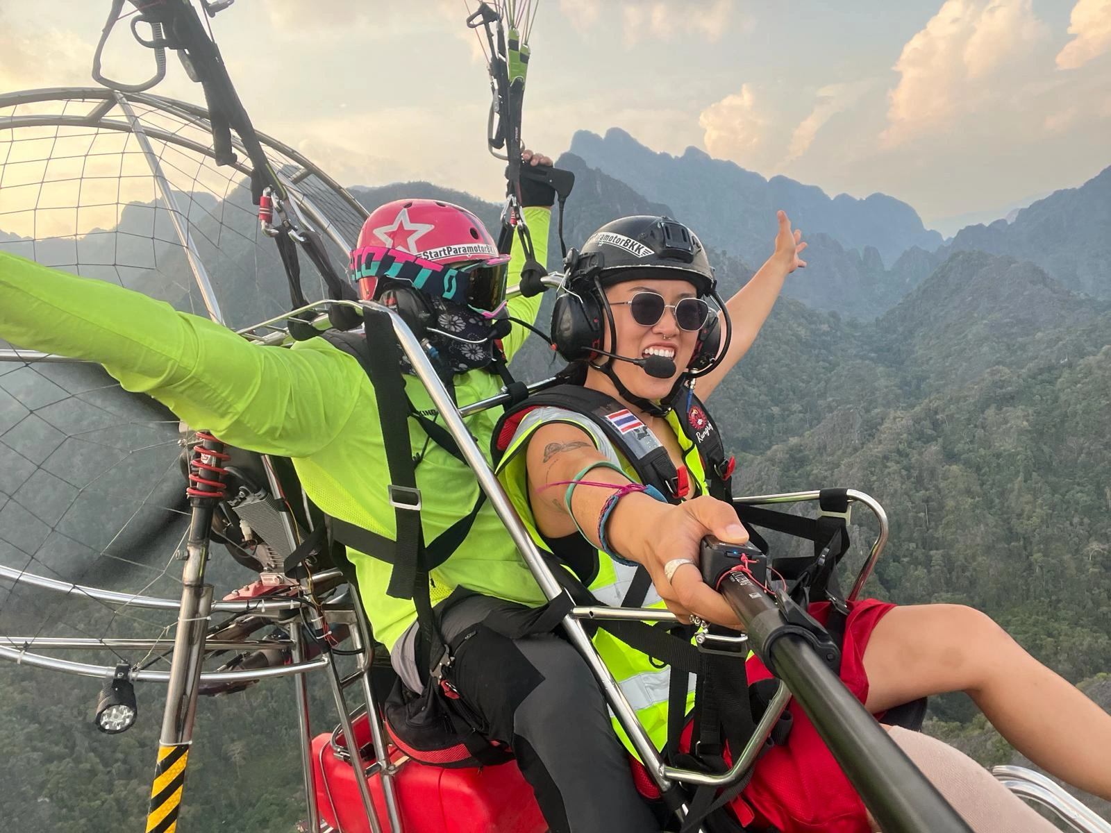 Paramotor pilot over Vang Vieng Paramotor pilot over Vang Vieng