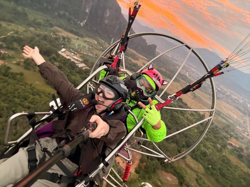 Twilight sunrise behind red mountains in Vang Vieng Laos