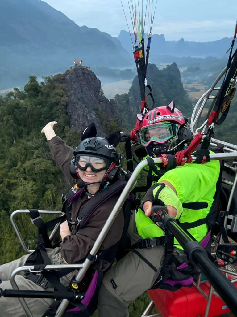 Paramotor flight near mountain peak in Vang Vieng